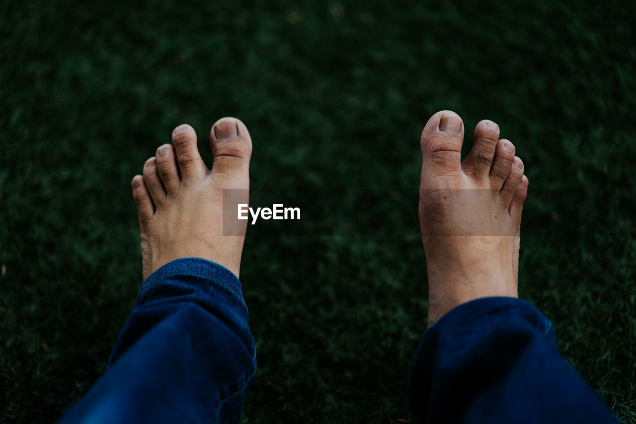 Low section of man legs on land