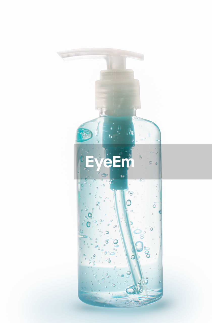 CLOSE-UP OF WATER BOTTLE IN GLASS