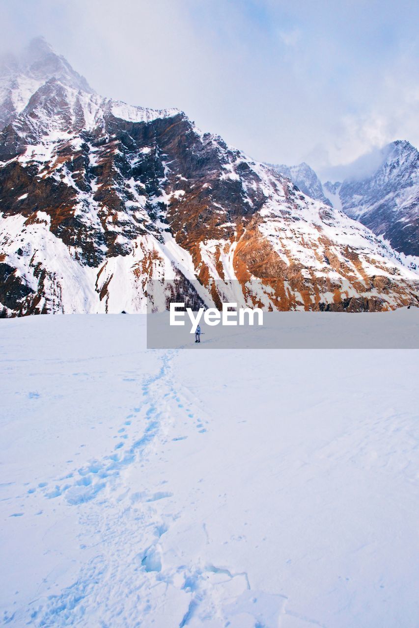 Scenic view of mountains against sky during winter