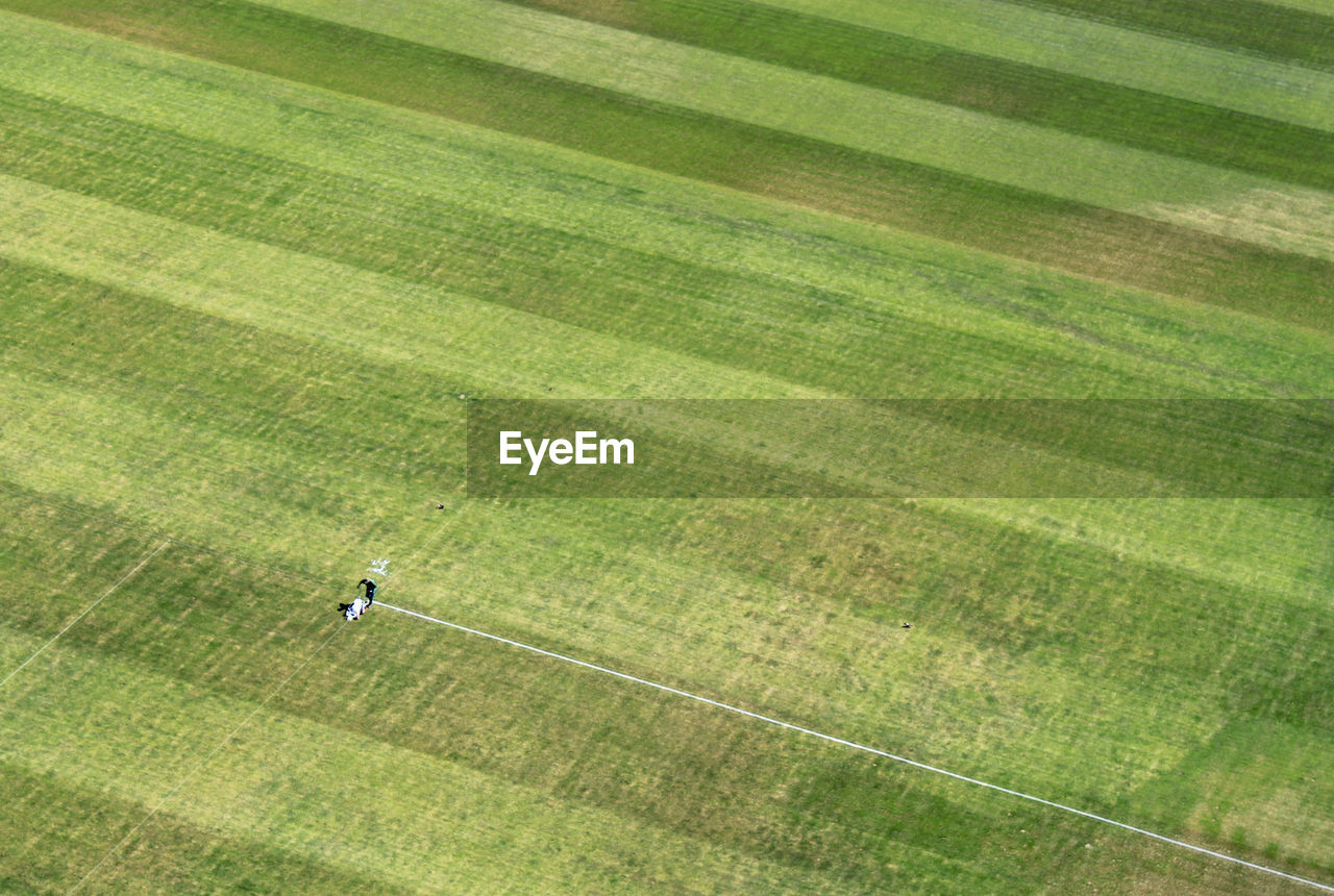Aerial view of person making yard lines at soccer field