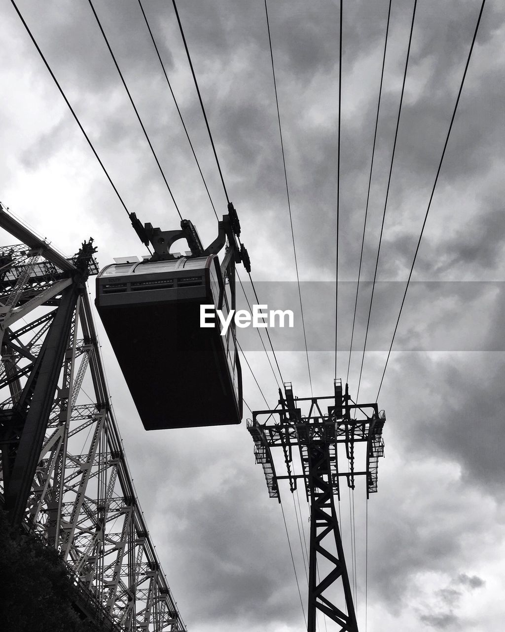 Low angle view of electricity pylon against sky