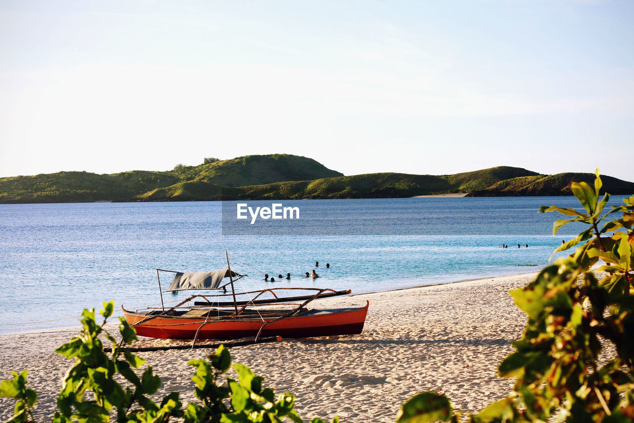 VIEW OF BOATS IN SEA
