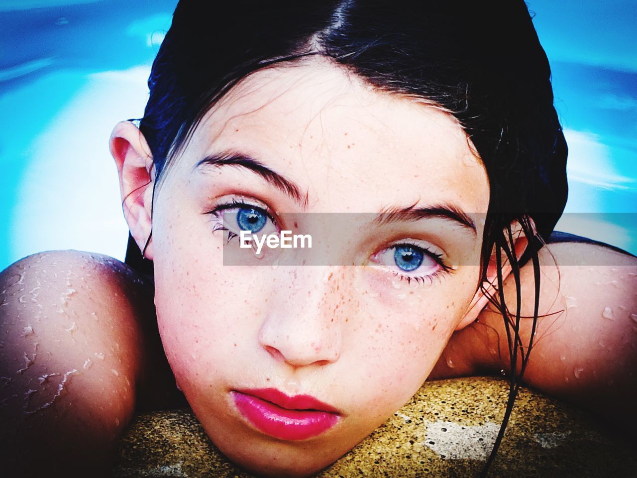 Close-up portrait of girl in swimming pool