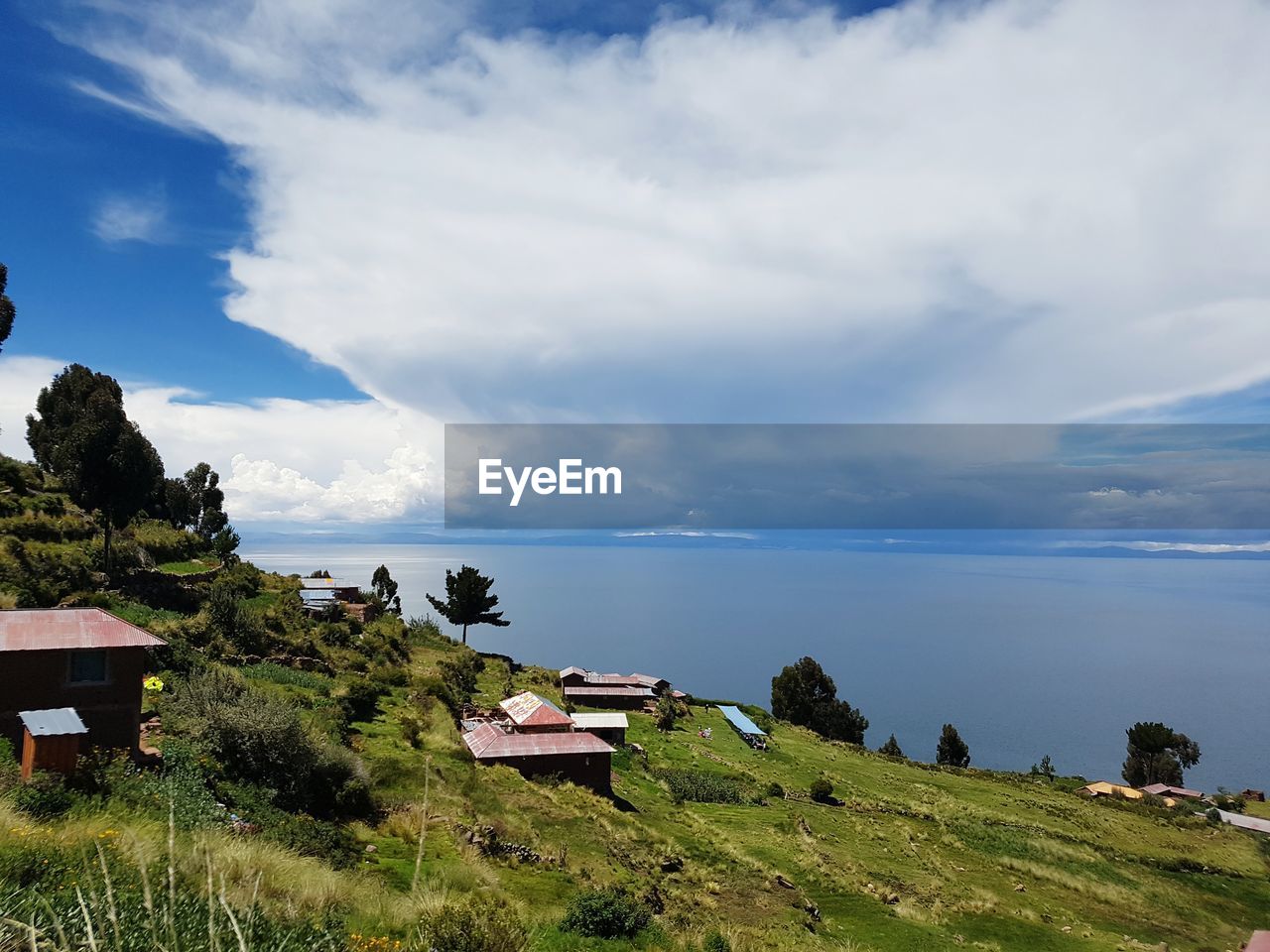 Scenic view of sea and buildings against sky