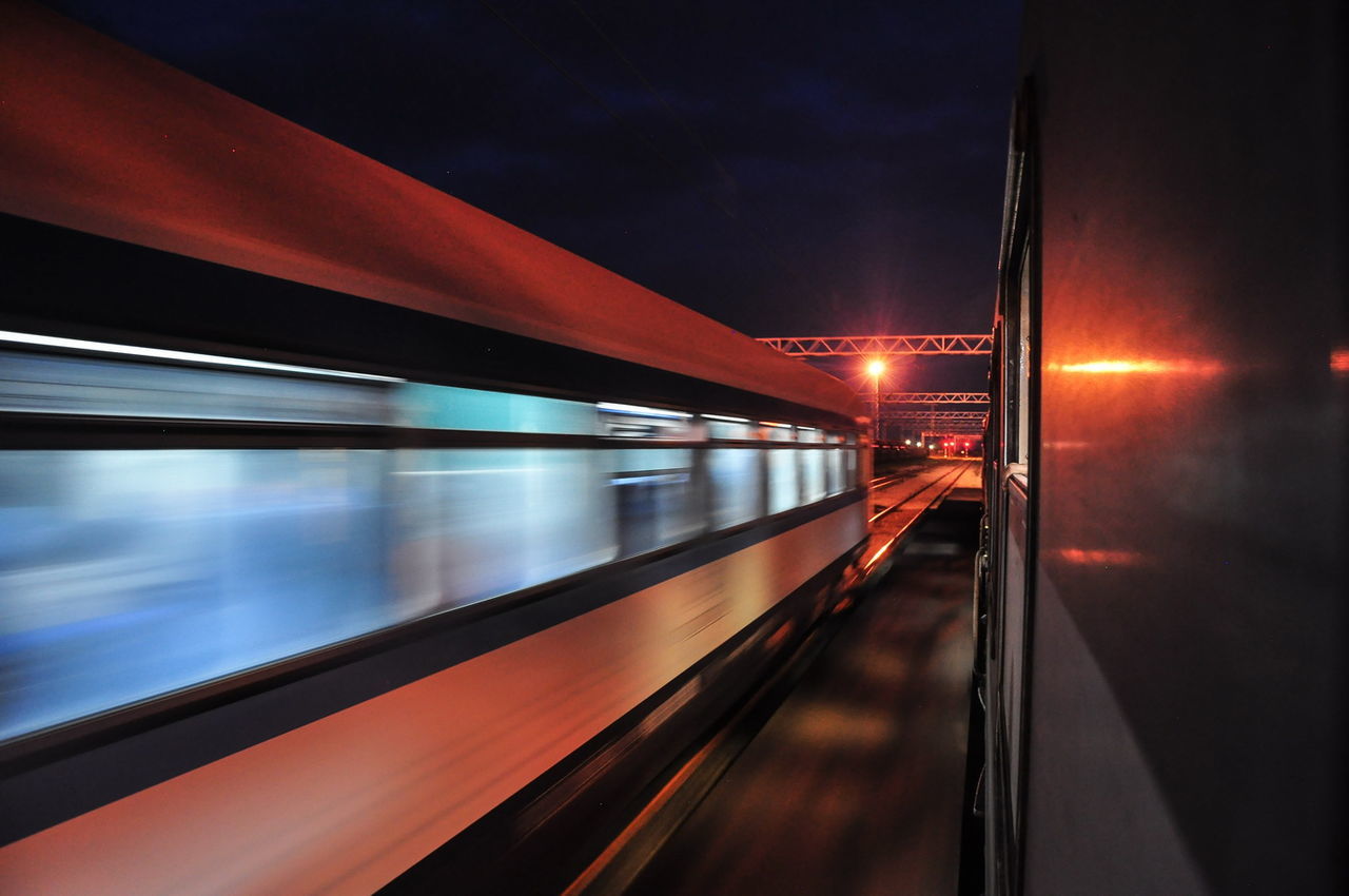 BLURRED MOTION OF TRAIN AT RAILROAD STATION