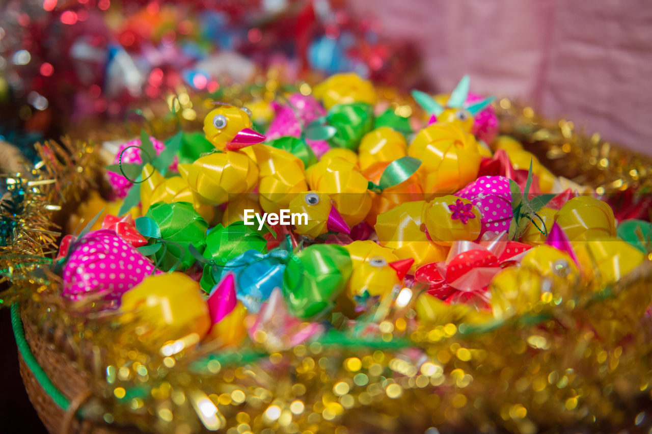 CLOSE-UP OF MULTI COLORED CANDIES IN PLATE