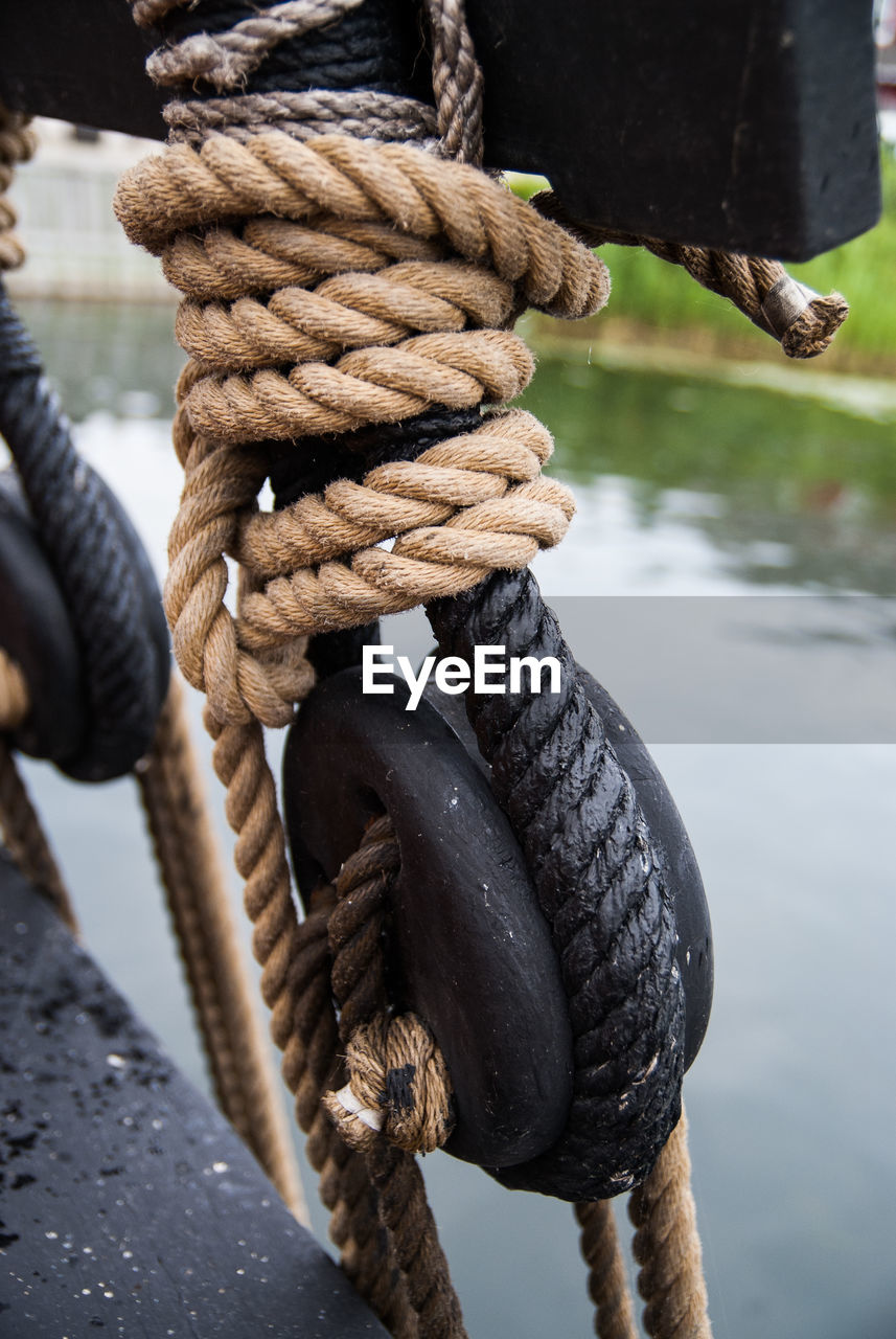 Close-up of rope tied on pulley