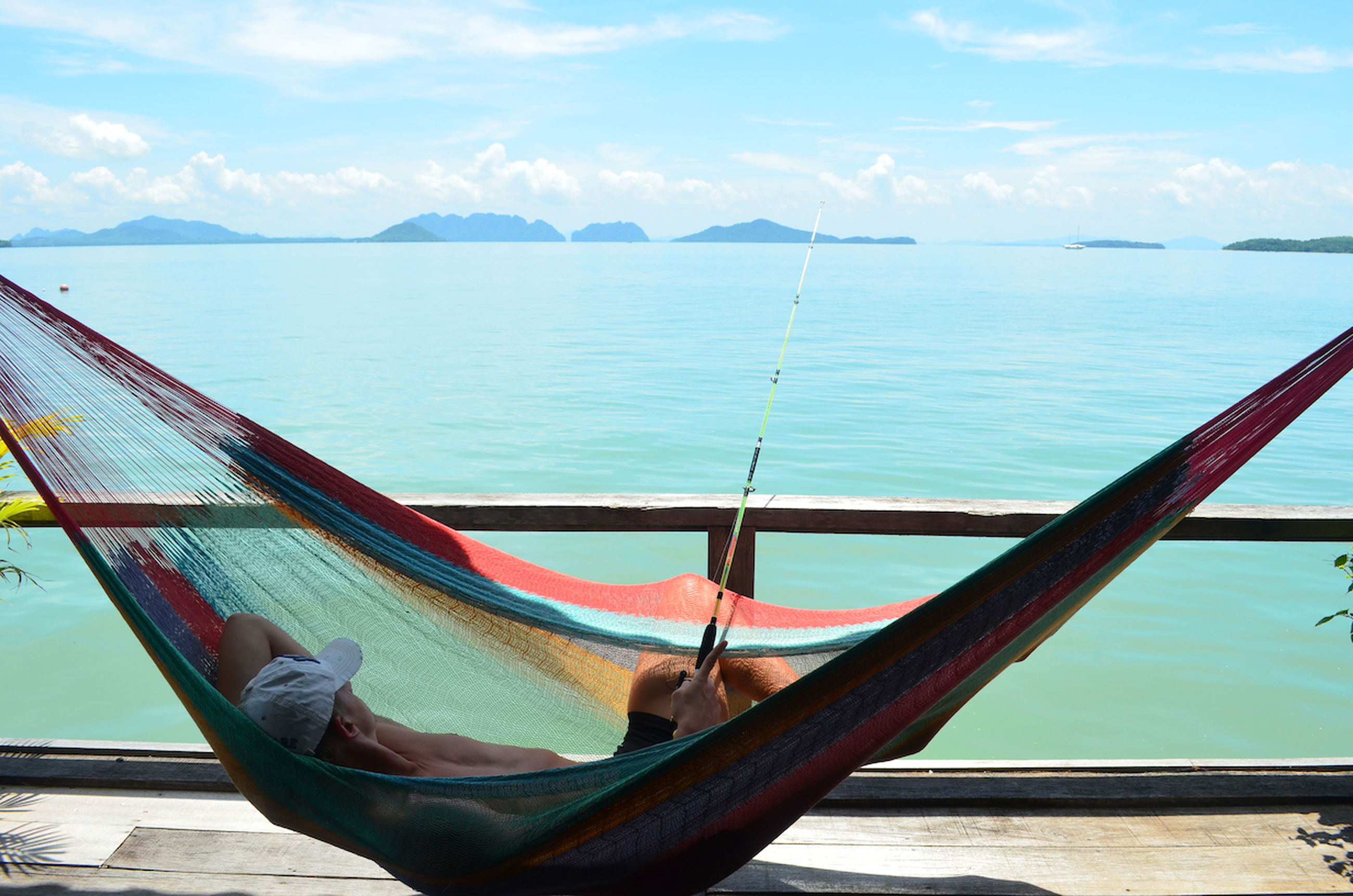 Shirtless Man Resting On Hammock While Id