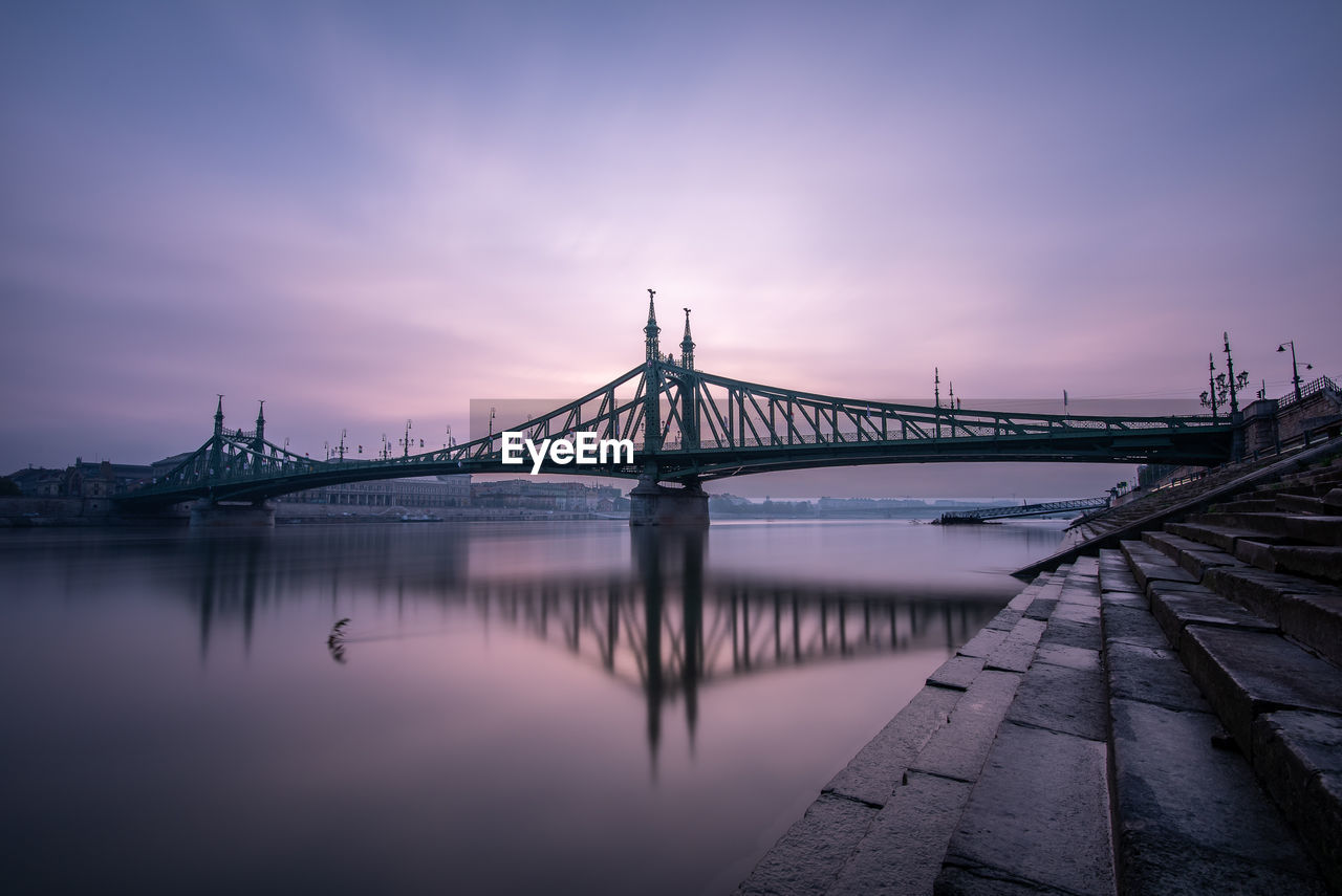 Bridge over river at sunsunrise