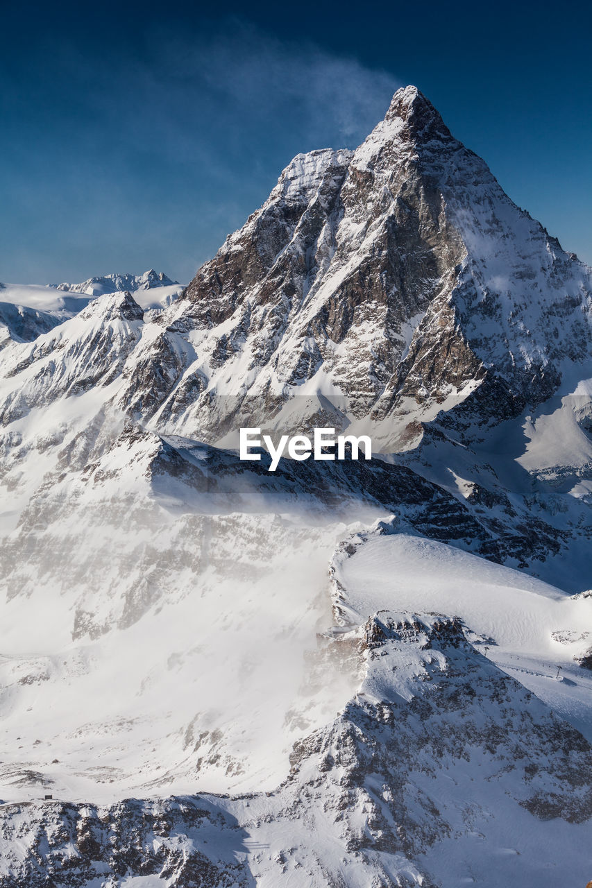 Scenic view of snowcapped mountains against sky. view from klein matterhorn, swiss alps