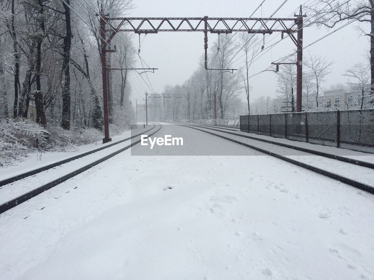 View of snow covered railroad track