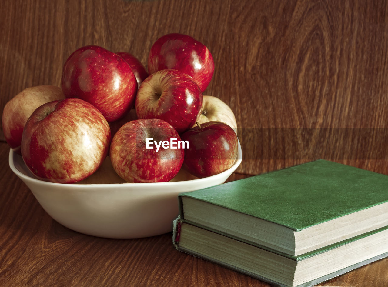 high angle view of apples in bowl on table