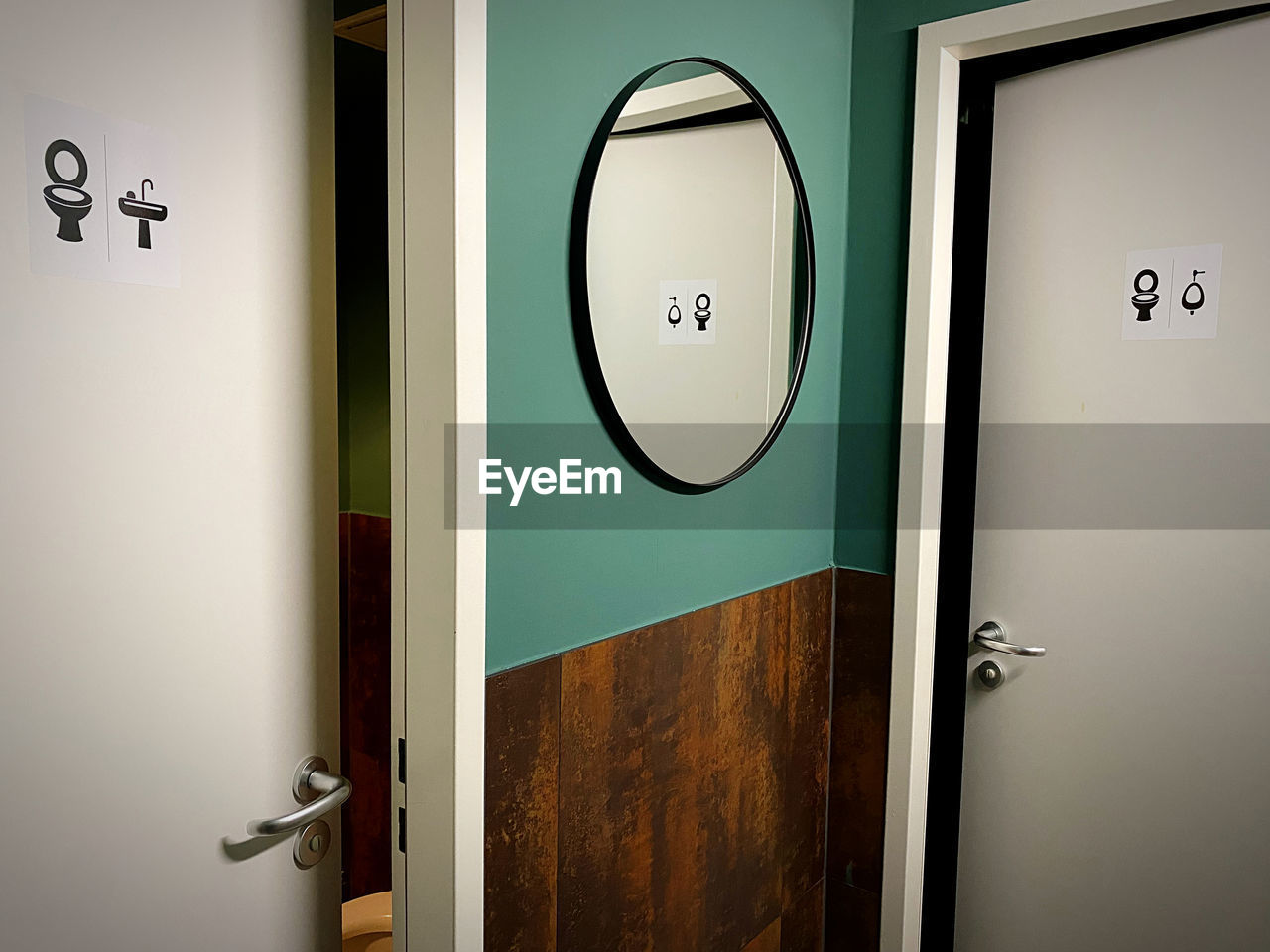 door, entrance, indoors, room, bathroom, door handle, public building, public restroom, no people, plumbing fixture, sign, doorknob, communication, number, restroom sign