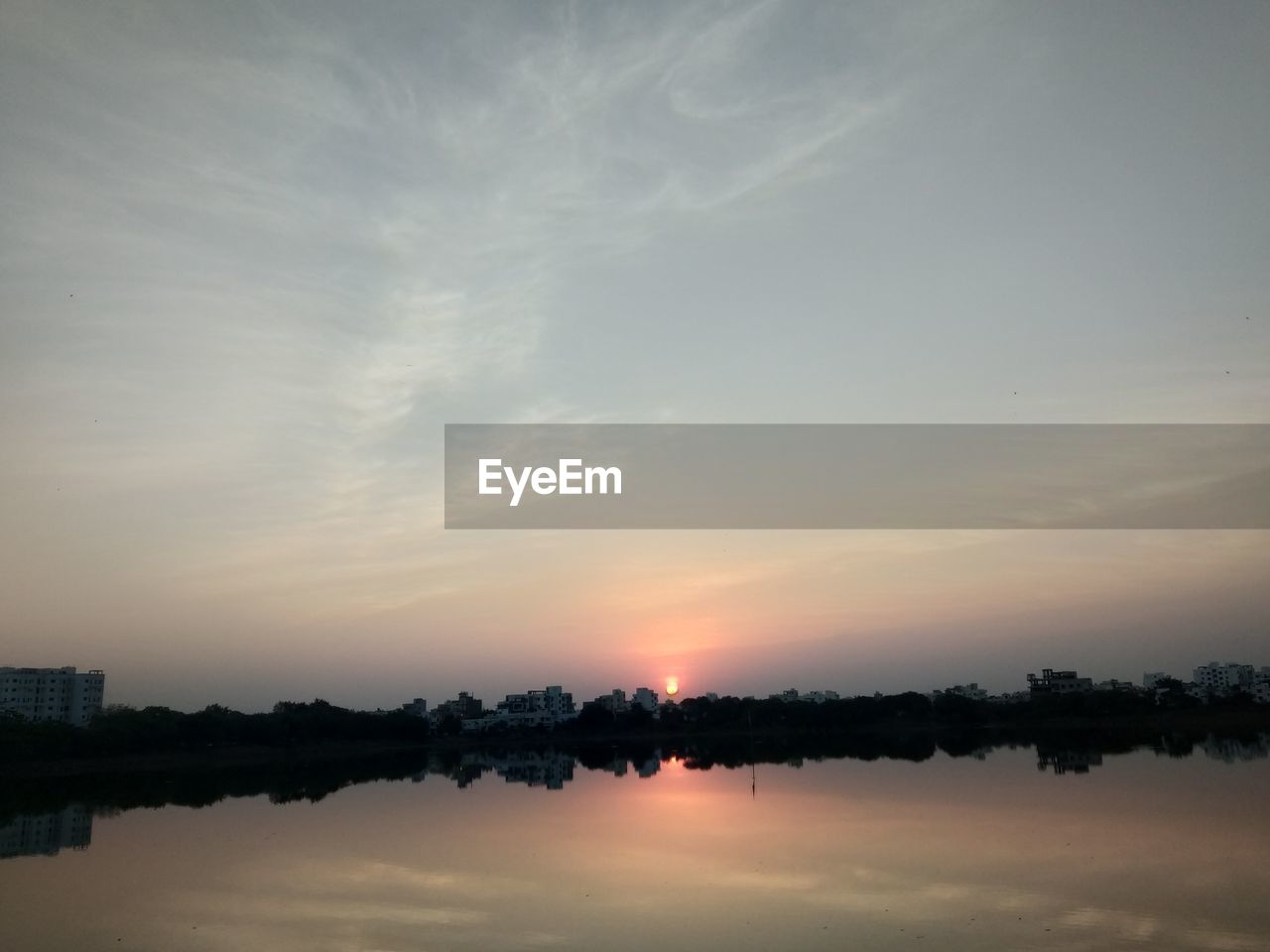 SCENIC VIEW OF LAKE DURING SUNSET