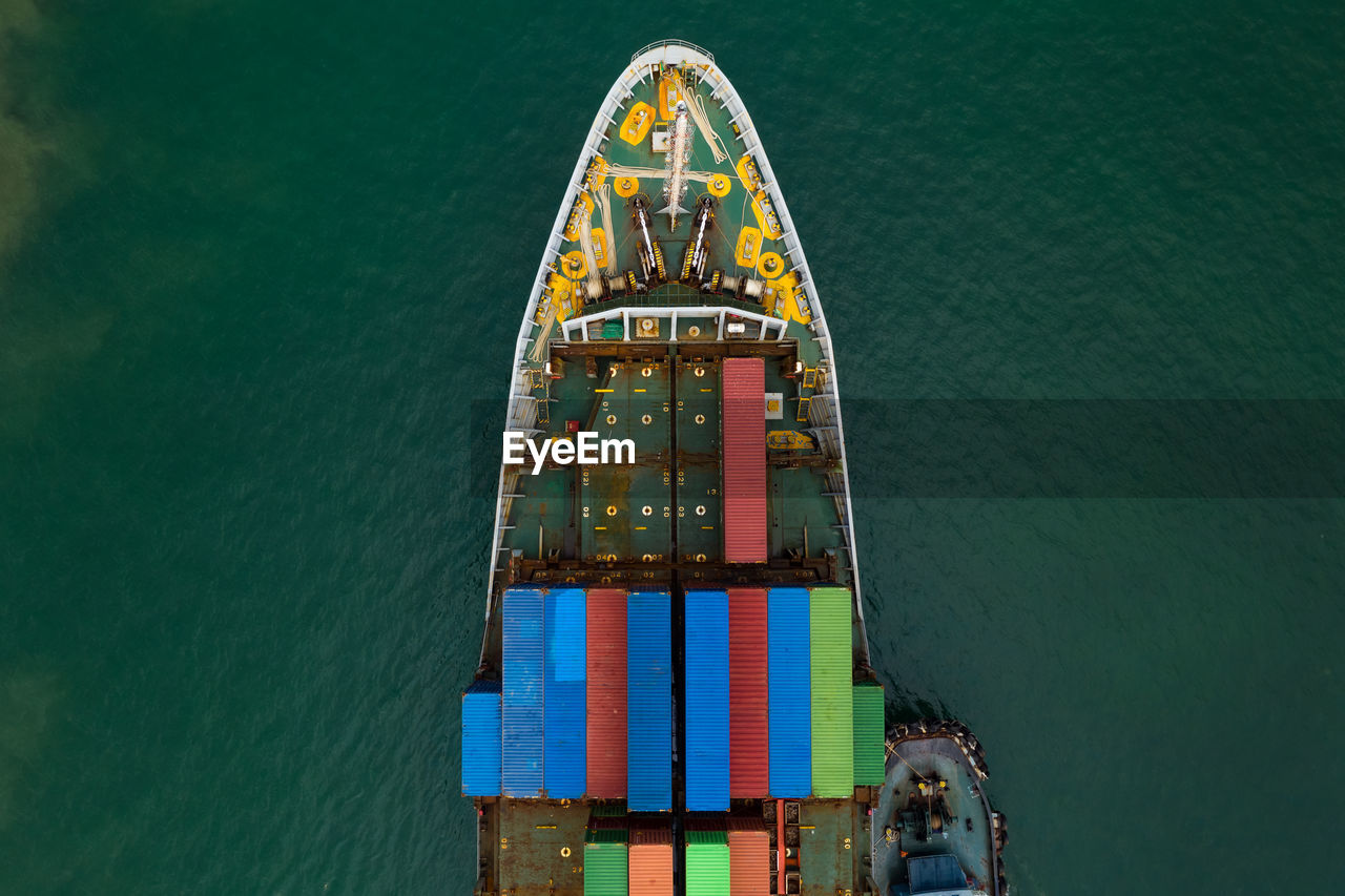 High angle view shipping containers transportation sailing on the sea 