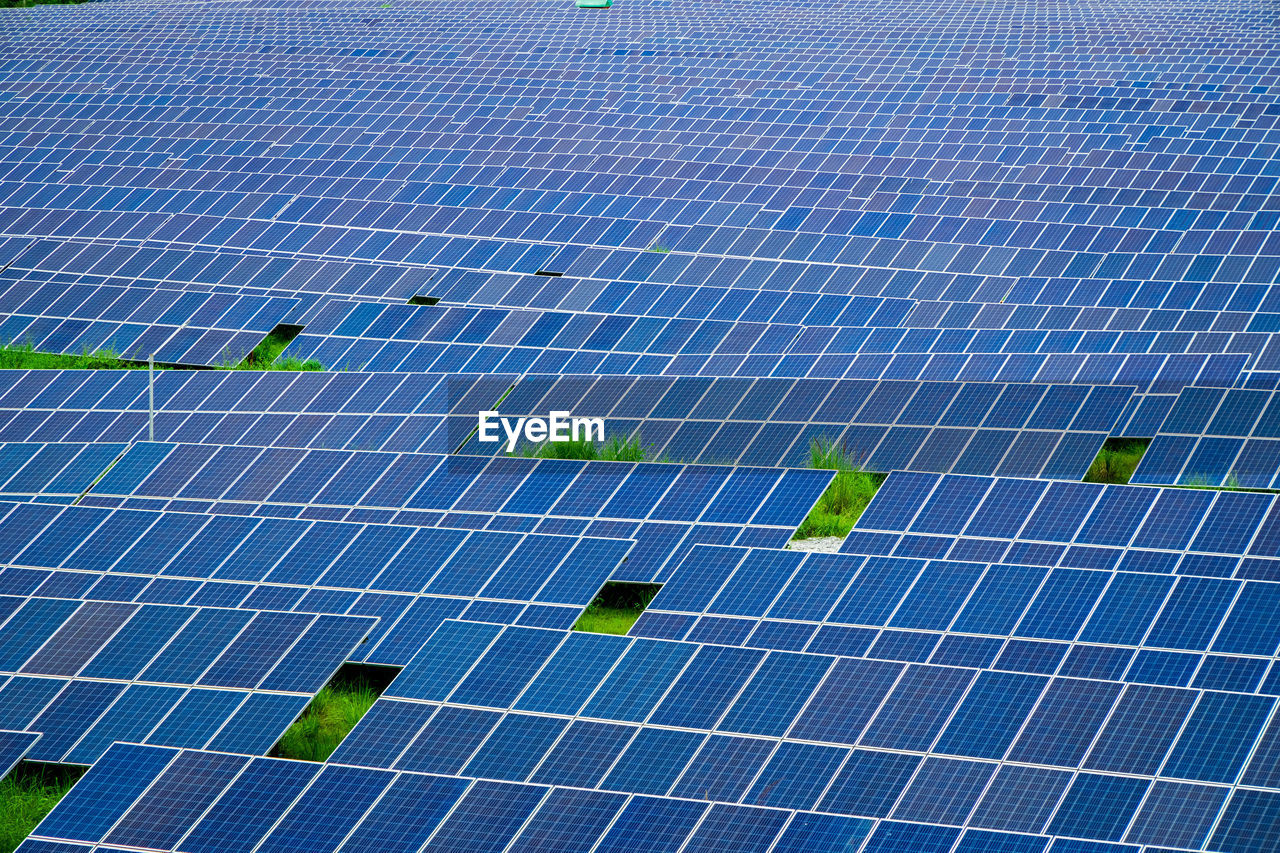 Many photovoltaic solar panels background at a solar farm