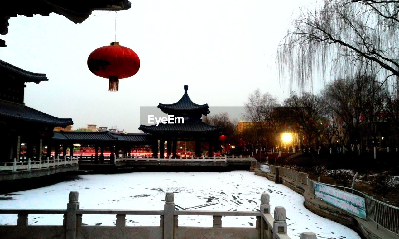 TEMPLE AGAINST BUILDING DURING WINTER
