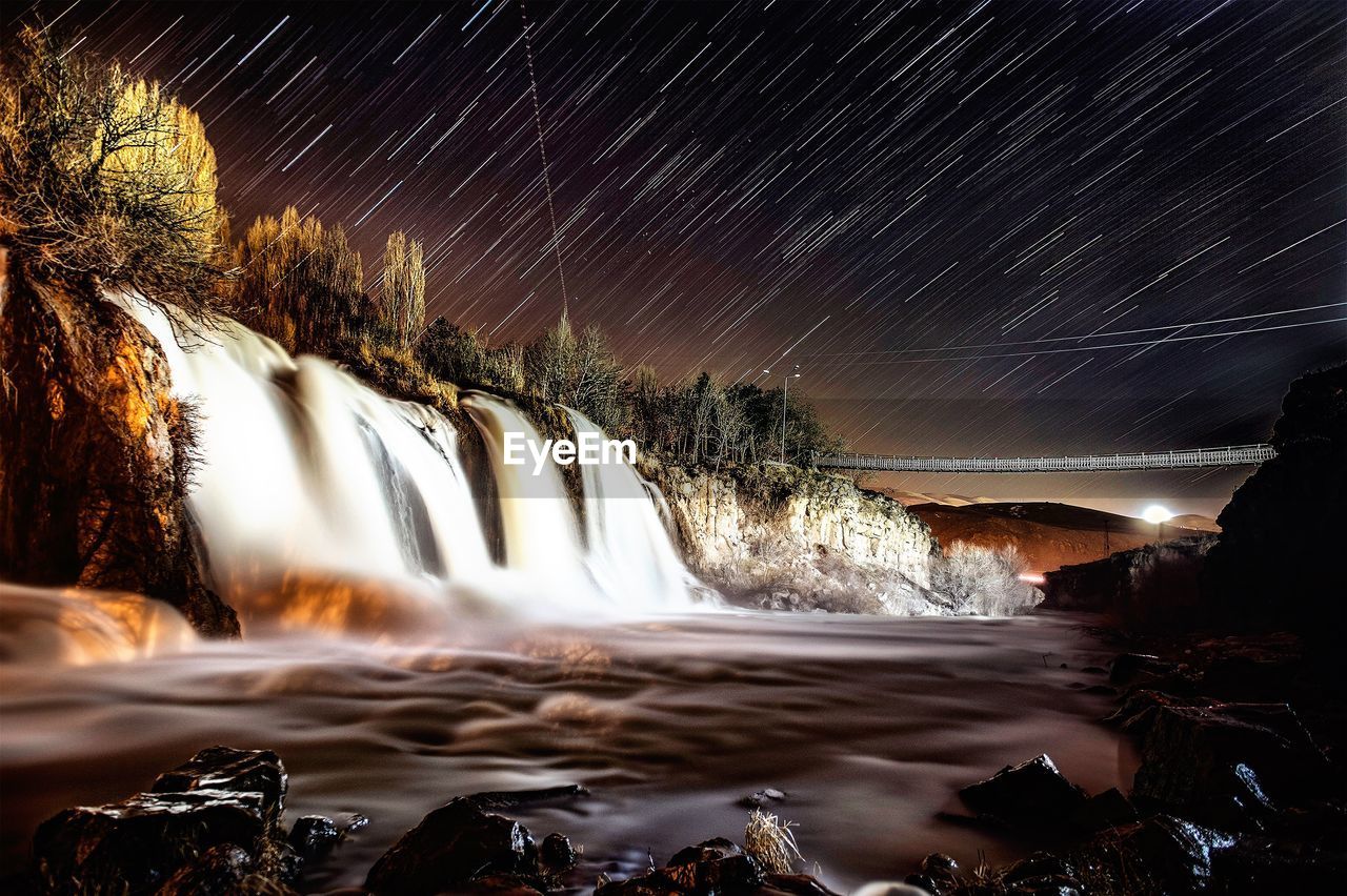 VIEW OF WATERFALL AT NIGHT