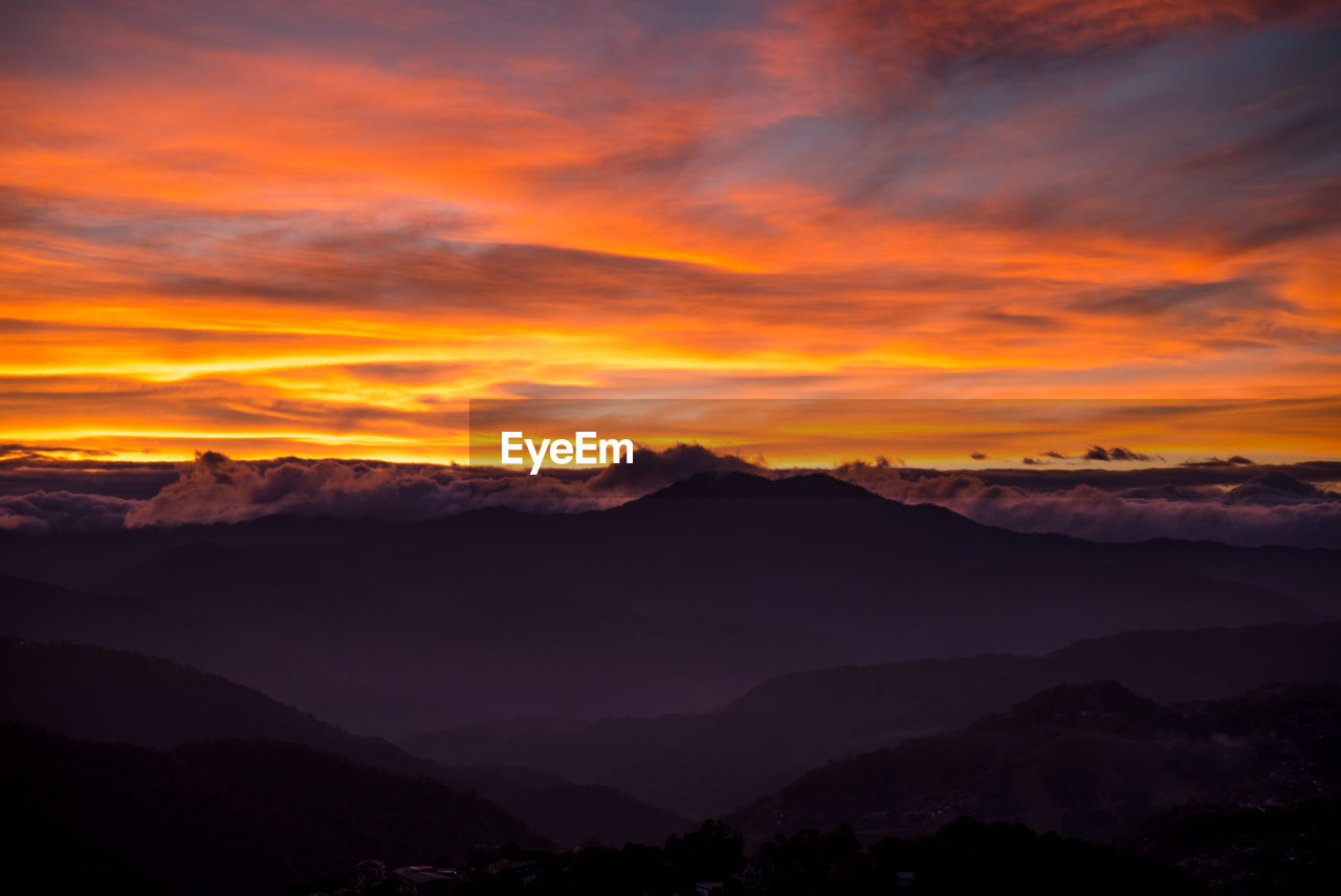Scenic view of dramatic sky during sunset
