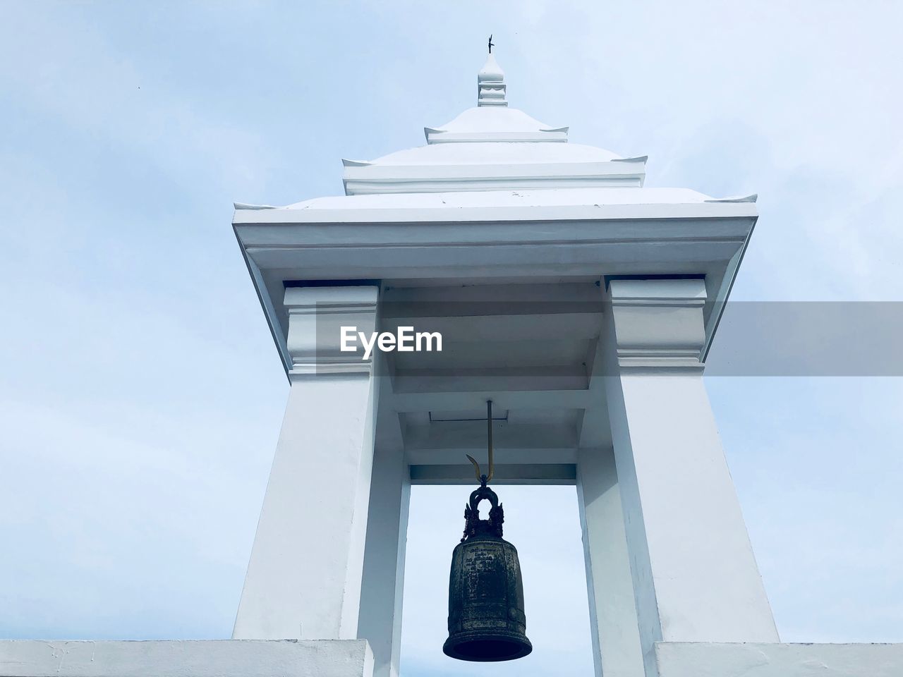 Low angle view of statue against building against sky