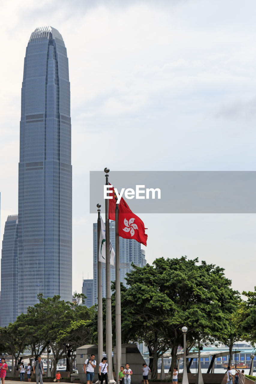 Hong kong flag against two international finance center in city