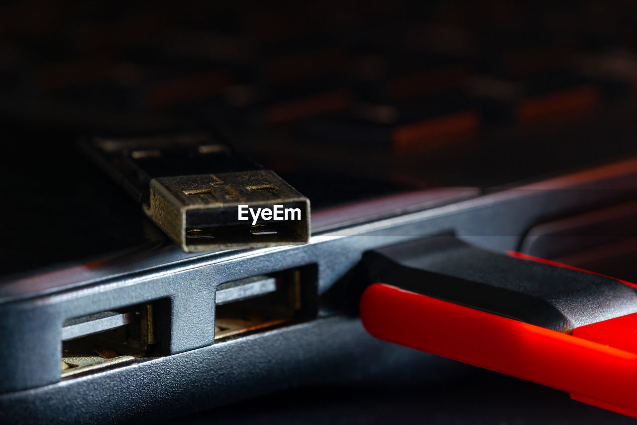 Close-up of usb stick attached to laptop