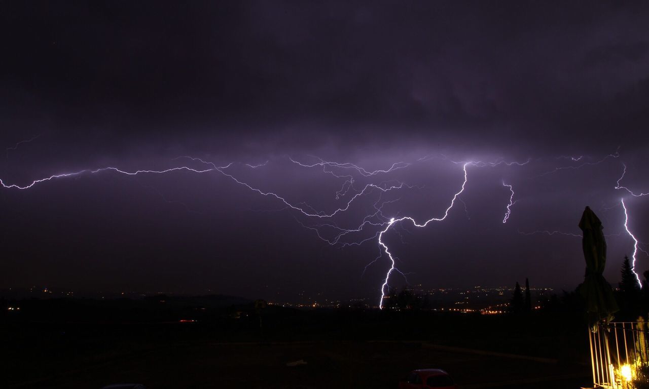 View of lightning strike against sky at night
