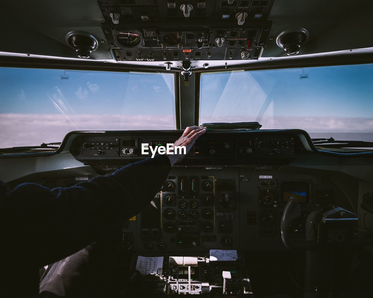Person in cockpit of airplane
