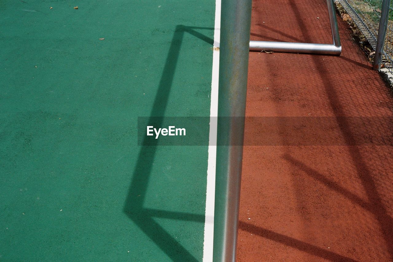 High angle view of a goal post and its shadow