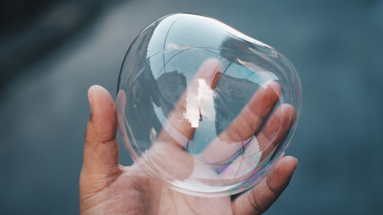 Close-up of hand holding bubble