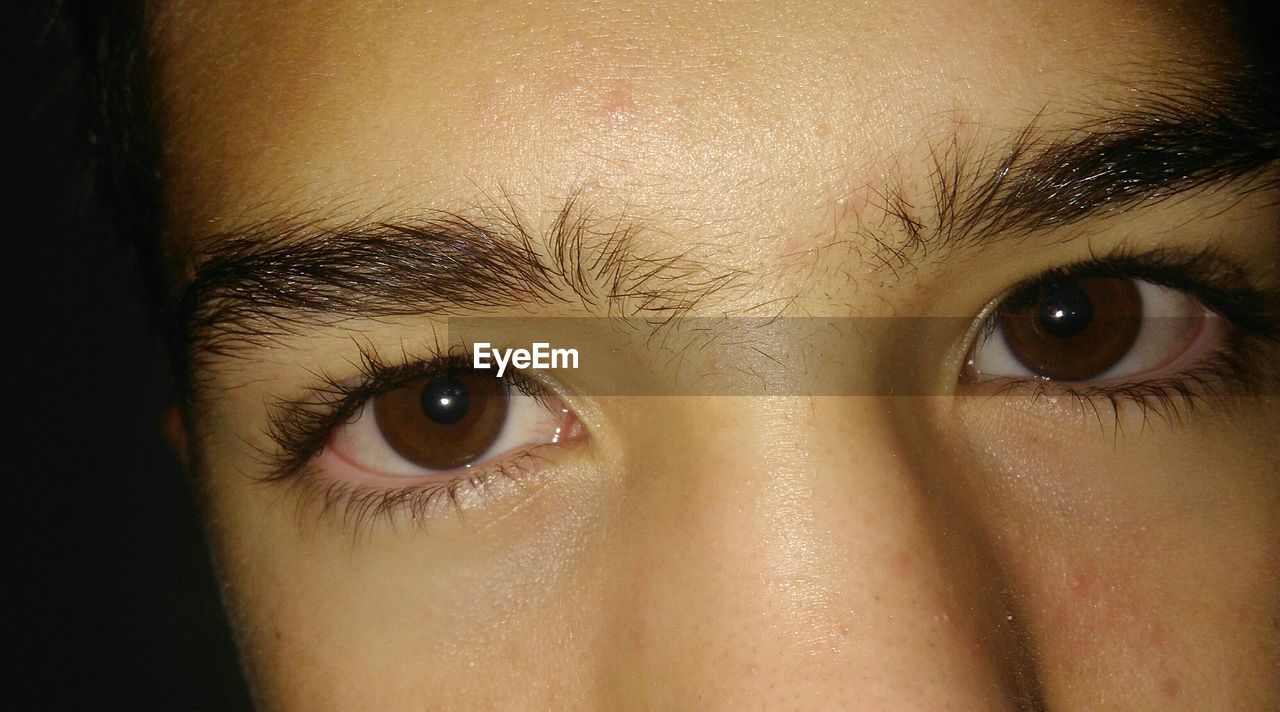 Closeup of human eyes in darkroom ID 104739170