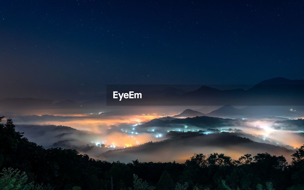Scenic view of sea of clouds on jinlong mountain at night, taichung taiwan