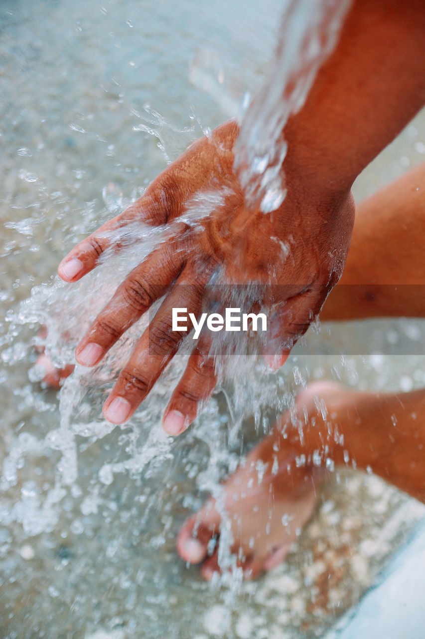 Low section of person in water