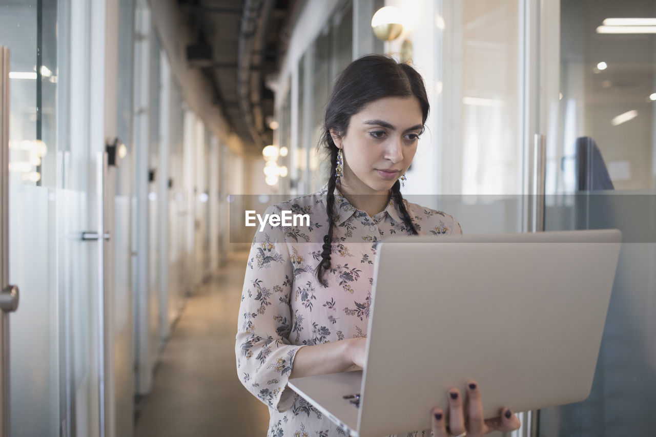 Young professional woman working on a laptop