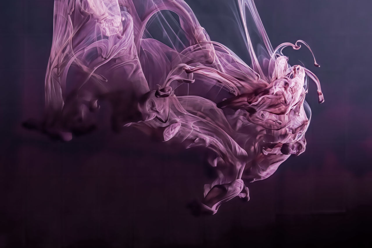 Beautiful abstract background of purple ink in water