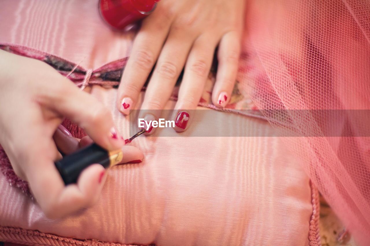 Close-up of painting nails