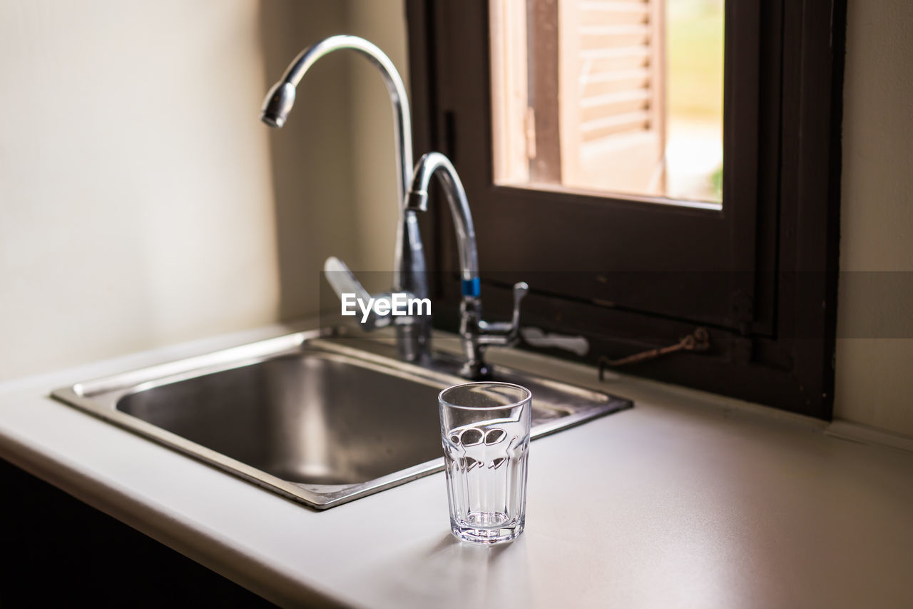 CLOSE-UP OF FAUCET