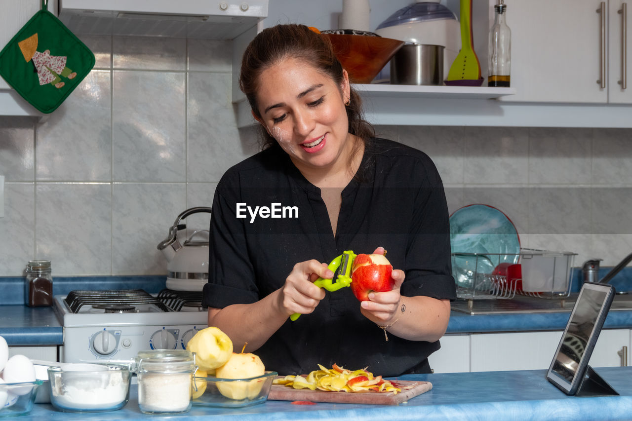 Woman preparing food at kitchen counter