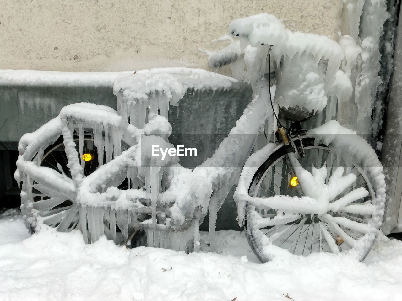 SNOW COVERED BICYCLE ON STREET