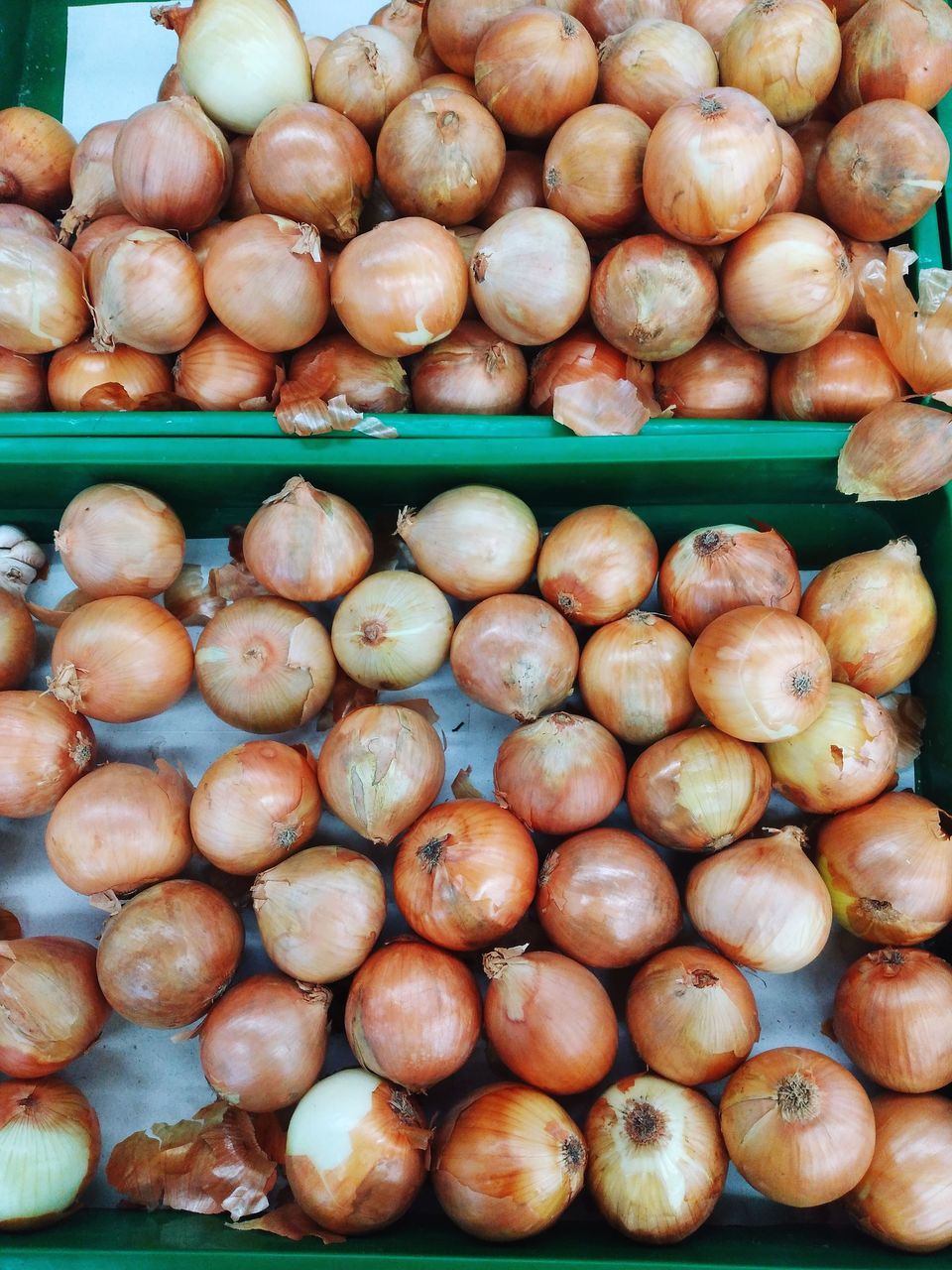 High angle view of onions for sale at market stall
