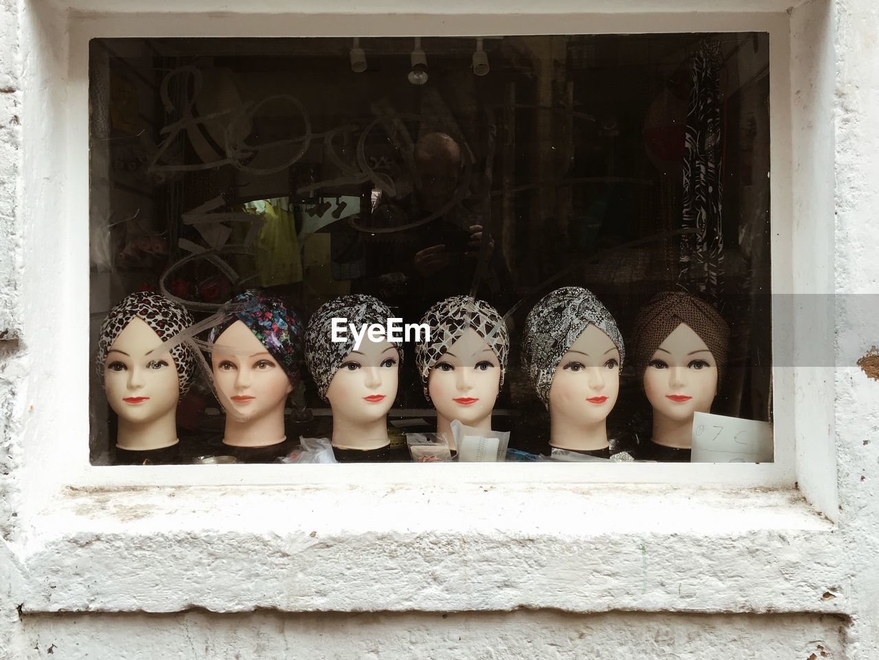 Close-up of mannequin heads wearing scarves