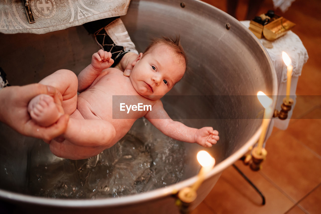 High angle view of baby taking bath