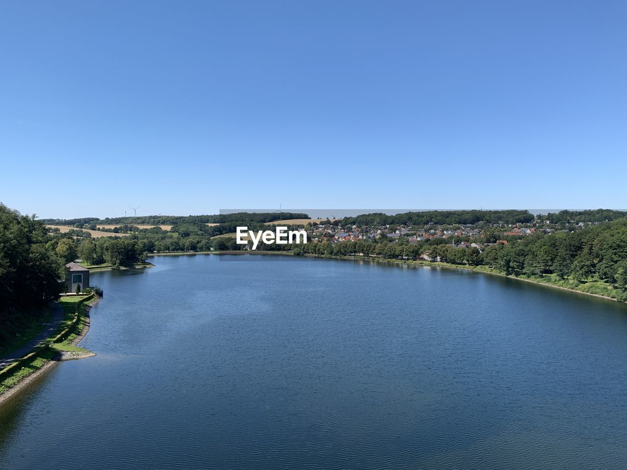 SCENIC VIEW OF RIVER AGAINST BLUE SKY