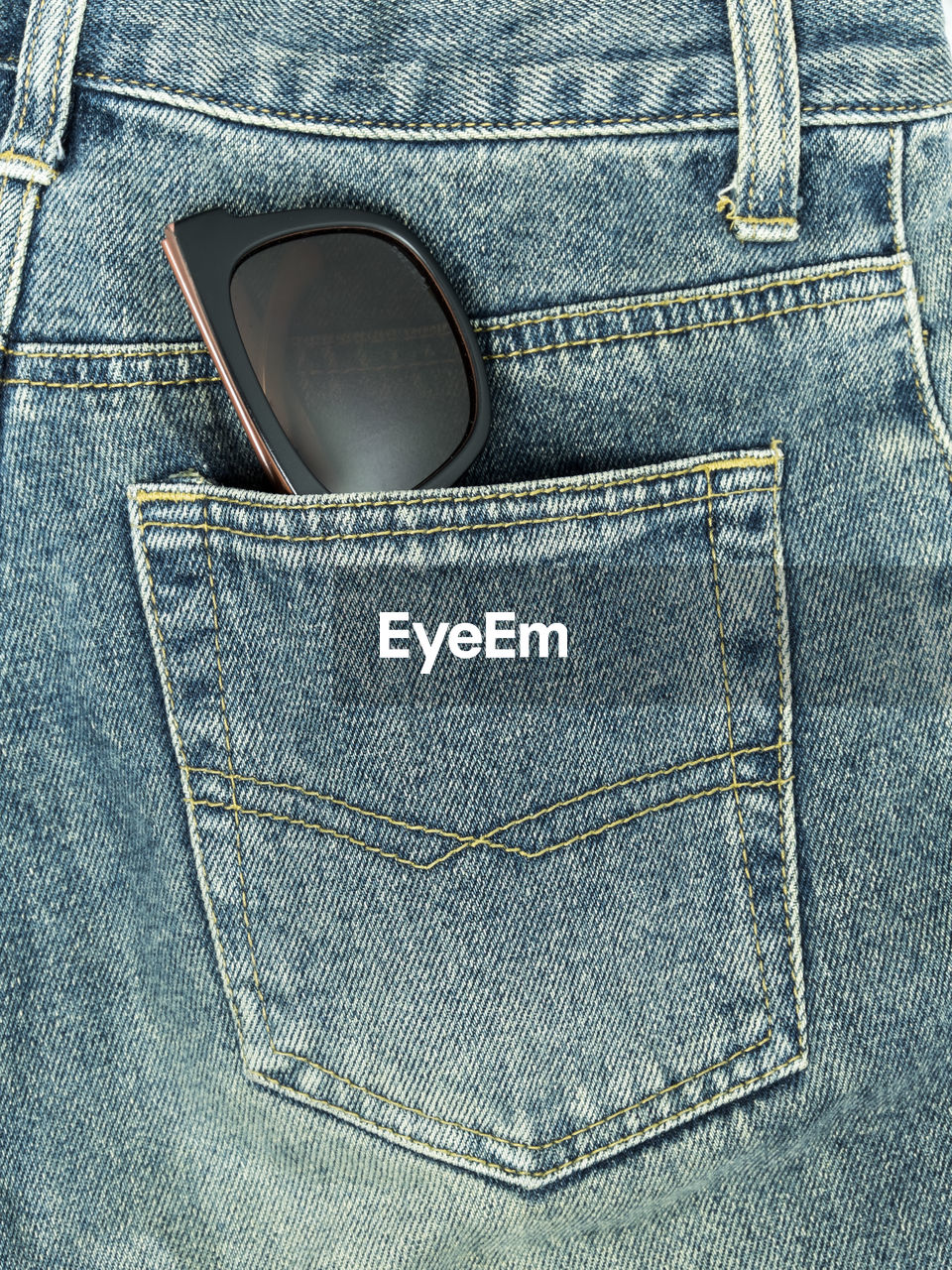 Sunglasses in jeans pocket