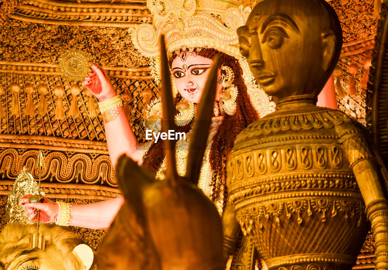 Goddess durga statue in jewelery and ceremonial make up during famous durga puja festival.