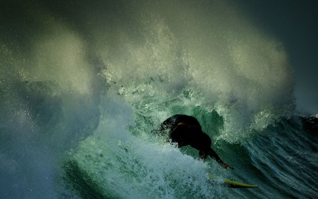 Person surfing in sea