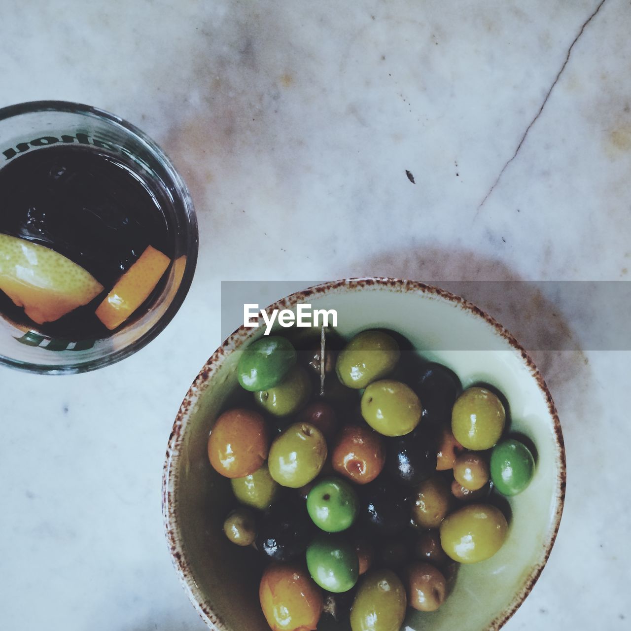 Directly above shot of olives in bowl on table