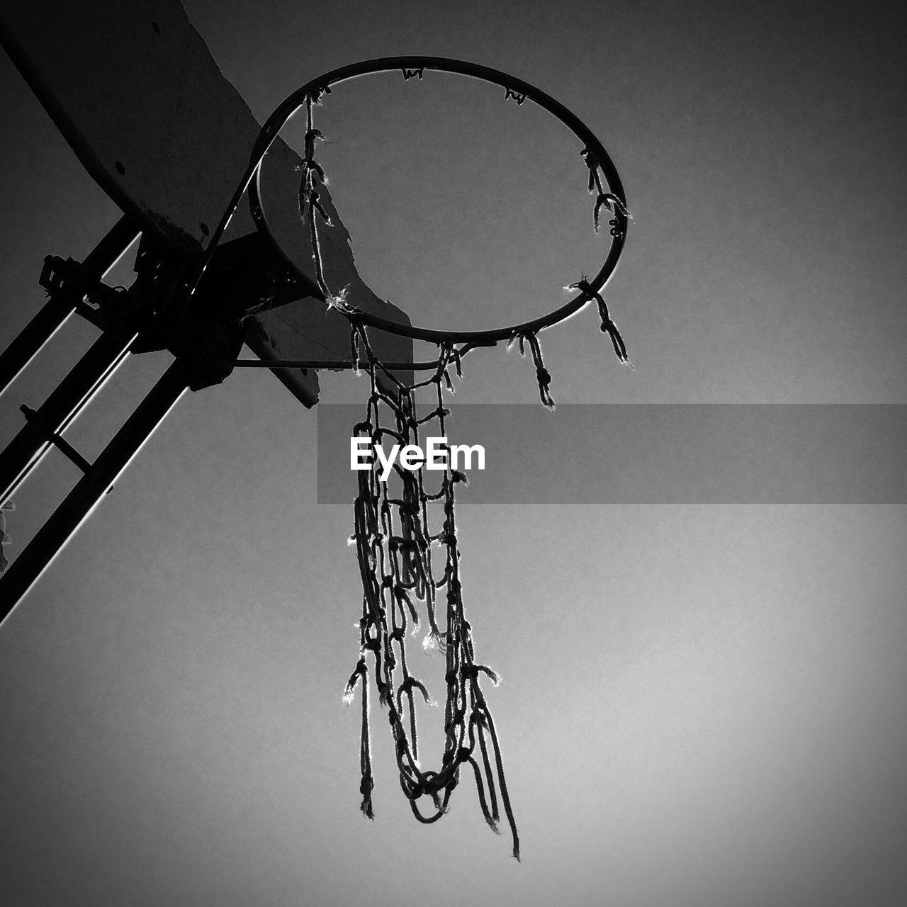 Low angle view of broken basketball hoop against sky
