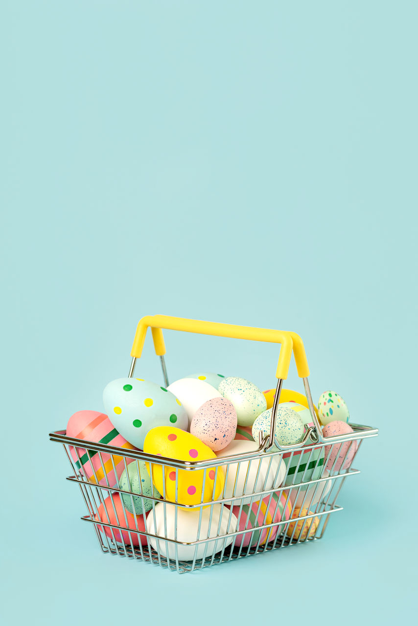 high angle view of small shopping cart against white background