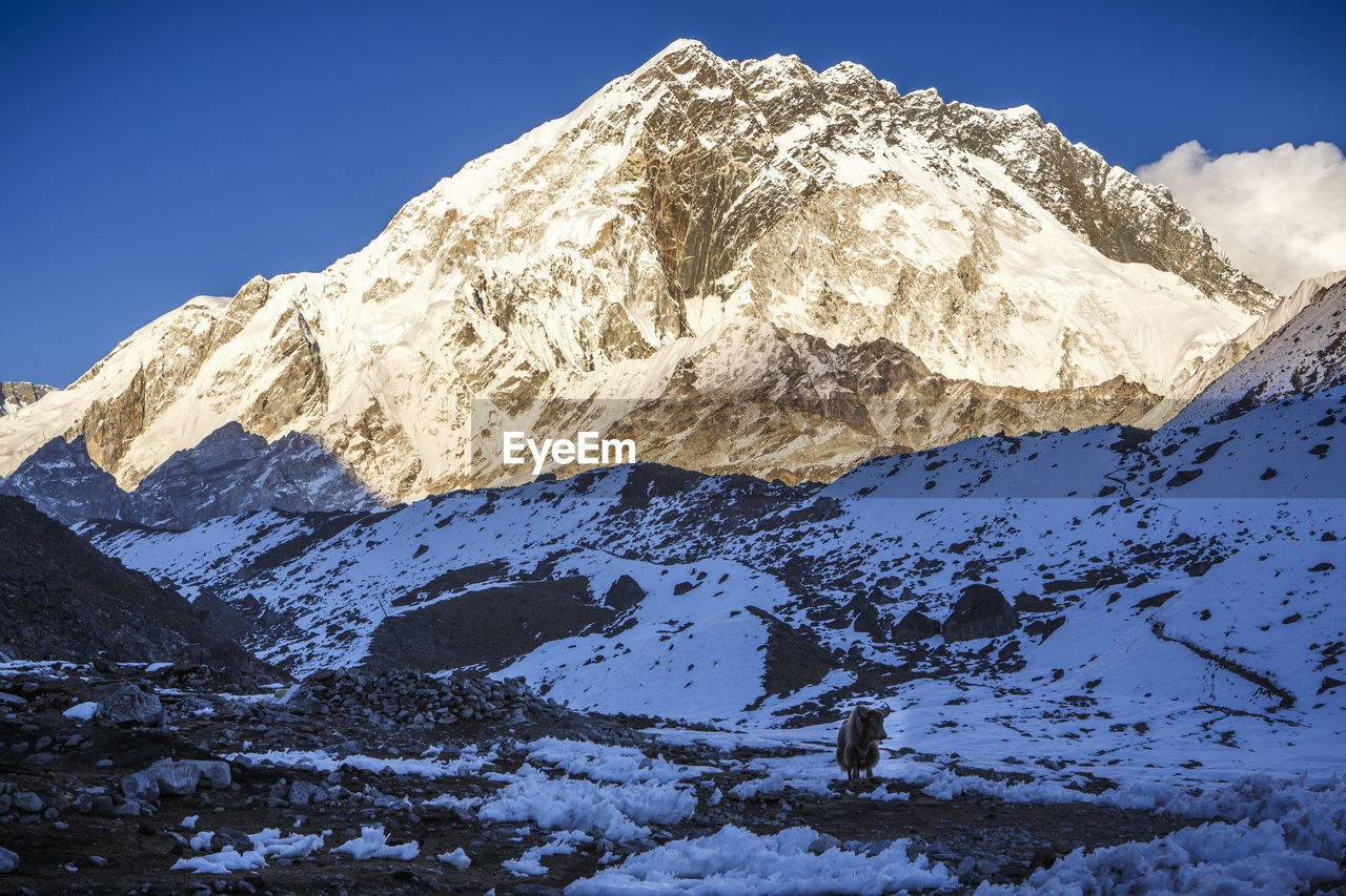 Sunset on a peak near the trail to mt everest base camp, nepal.